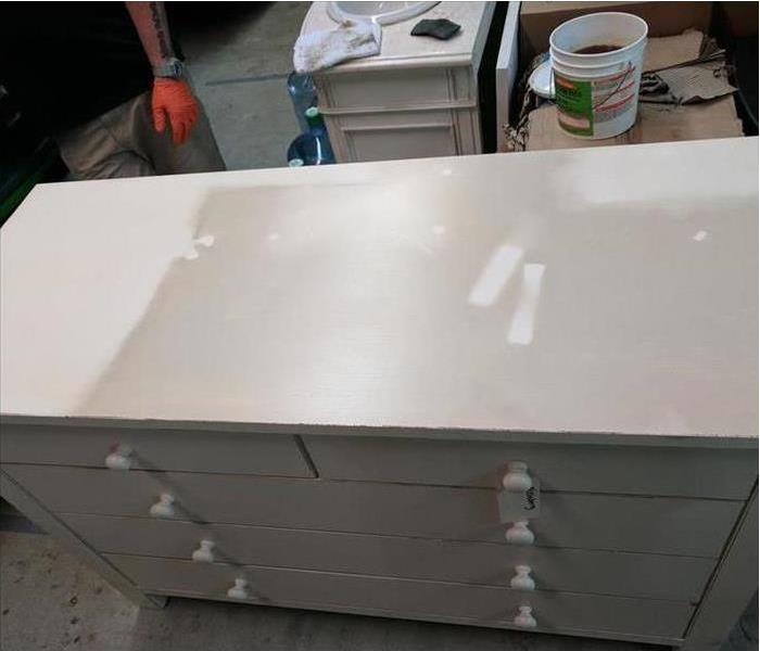 sooty covered white dresser, slightly cleaned