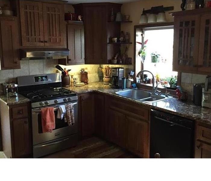 the remodeled kitchen with new cabinets