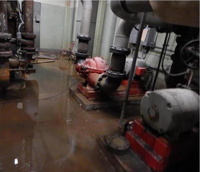 pumps in a plant, flooding on concrete pad